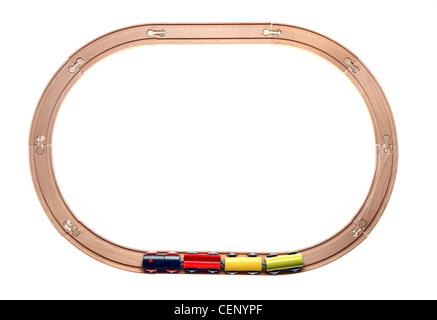 Symbol image. Wooden toy trains on rails. Stock Photo