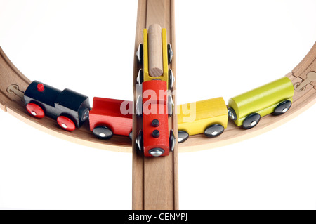 Symbol image. Wooden toy trains on rails. Stock Photo