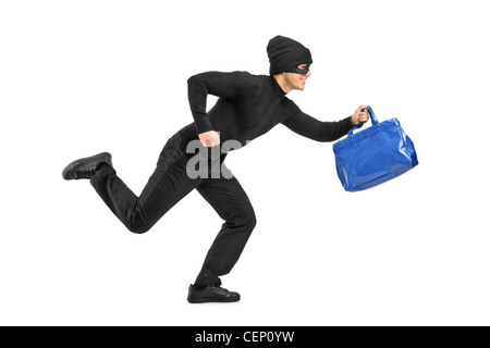 Full length portrait of a thief running with a stolen purse isolated on white background Stock Photo
