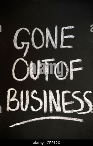 Blackboard with GONE OUT OF BUSINESS written on it in white chalk Stock Photo