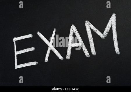Blackboard with the word EXAM written on it in white chalk Stock Photo