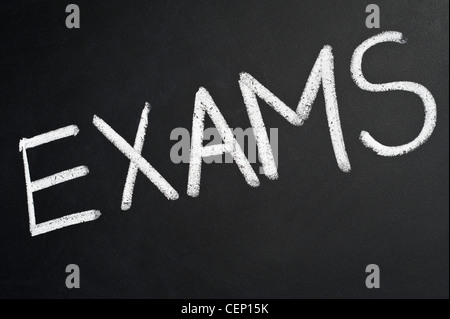 Blackboard with the word EXAMS written on it in white chalk Stock Photo