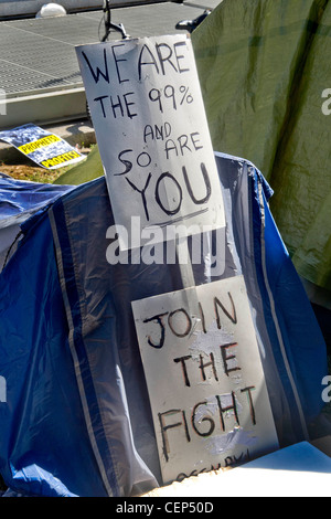 A sign expressing the 'We-Are-the-99-%' sentiment reflects the anti-establishment attitude of Occupy Wall Street protesters. Stock Photo