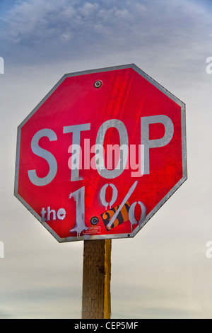 Grafitti on a traffic stop sign expresses the view of the nearby Occupy Wall Street protest at Los Angeles City Hall in October, Stock Photo