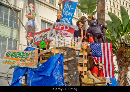 Occupy Wall Street protesters build a tree house at Los Angeles City Hall during their occupation in October, 2011. Note signs. Stock Photo