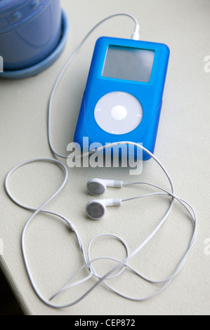 Woman using Apple Ipod Stock Photo