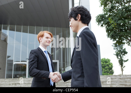 Two businessmen shaking hands Stock Photo