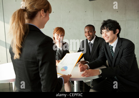 Businessmen and businesswomen having a meeting Stock Photo