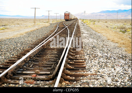 Freight train on tracks, near the edge of the Black Rock Desert, NW Nevada, US Stock Photo