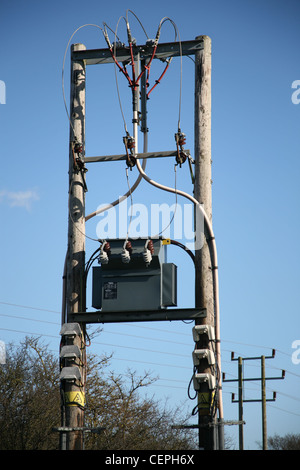 Pole mounted electricity transformer and overhead power lines. Kirkby ...