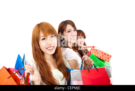 three young women with shopping bag and isolated on white background Stock Photo