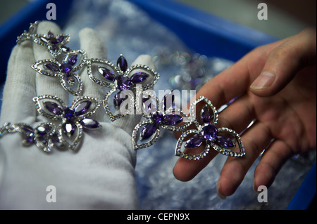 Employees make fashion jewelry in Zhejiang Neoglory Jewelry Co., Ltd. in Yiwu, Zhejiang, China.  07-Nov-2011 Stock Photo