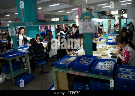 Employees make fashion jewelry in Zhejiang Neoglory Jewelry Co., Ltd. in Yiwu, Zhejiang, China.  07-Nov-2011 Stock Photo
