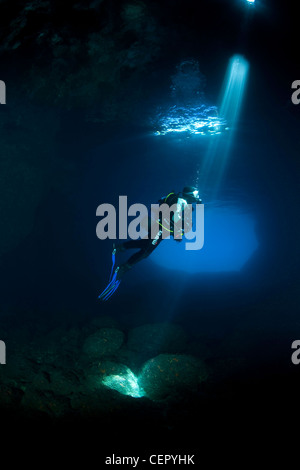 Scuba Diver Silhouette in Green Cave, Vis Island, Adriatic Sea, Croatia Stock Photo
