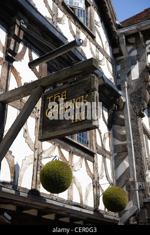 Wooden signage hanging outside The Garrick Inn, a traditional black and ...