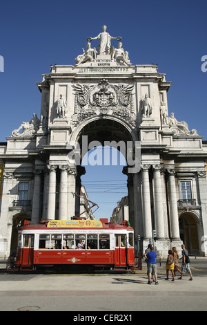 Rua Augusta Arch and a Yellow Bus Sightseeing Tour Tram, Praça do Comércio, Lisbon, Portugal Stock Photo