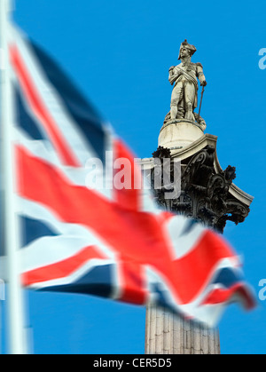 Union Jack with Nelson's Column in background. The column was built between 1840 and 1843 to commemorate Admiral Horatio Nelson' Stock Photo