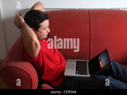 Profile of a single man using a laptop. Stock Photo