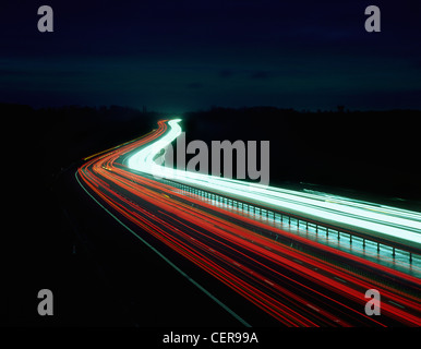 Light trails from traffic on the M11 motorway at night. Stock Photo