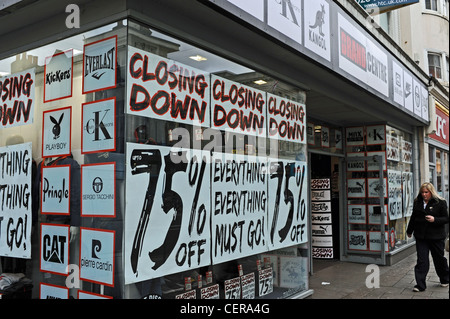 Closing Down sale signs on a shop front in Brighton Western Road UK Stock Photo