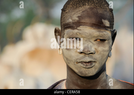 SOUTHERN SUDAN, Bahr al Ghazal region , Lakes State, Dinka tribe with Zebu cows in cattle camp near Rumbek, young shepherd with ash smeared face Stock Photo