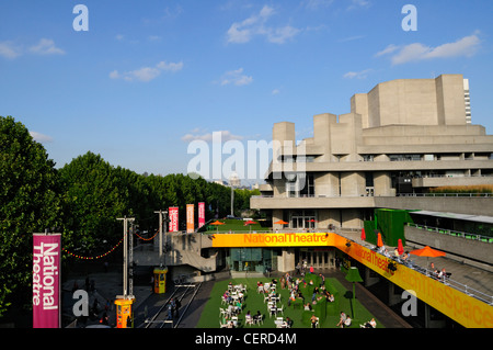 People relaxing in Theatre Square outside The National Theatre on the South Bank. Stock Photo
