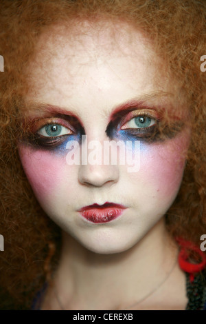 Galliano Backstage Paris Ready to Wear Autumn Winter Close up of model Lily Cole very curly red hair framing face wearing Stock Photo