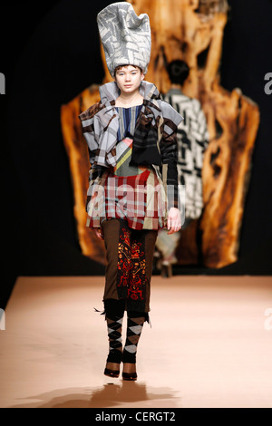 Vivienne Westwood Ready to Wear Paris A W Blonde female model her hair  piled on her head wearing a big puffy red dress huge Stock Photo - Alamy