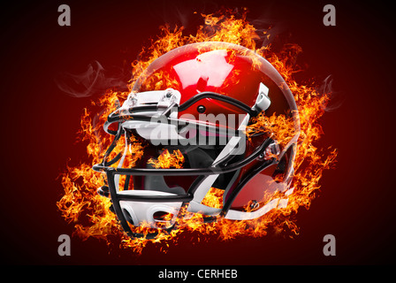 American football helmet in fire isolated on dark background Stock Photo