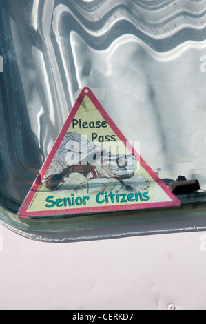Please pass senior citizens sign on an old caravan Stock Photo