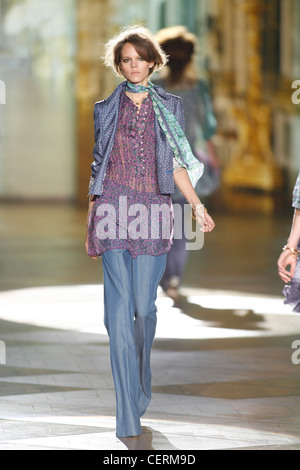 Roberto Cavalli Milan Ready to Wear S S Model Carmen Kass very long blonde  wavy hair wearing white ruffled sleeveless blouse Stock Photo - Alamy