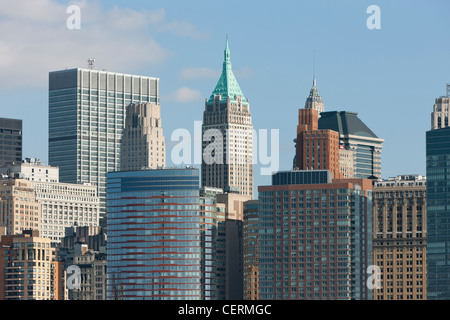 Lower Manhattan skyscrapers including the 70 story copper-topped 40 Wall Street (Trump Building) in New York City. Stock Photo