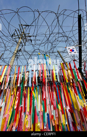 Barbed wire and wish ribbons wishing for peace and unity at the DMZ, De ...