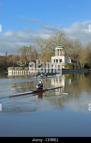 Rowers sculling past Temple Island, the start point of the Henley Royal Regatta course. Stock Photo