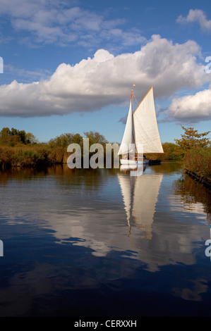 Sailing Boat on the River Ant in the Norfolk Broads National Park. Stock Photo