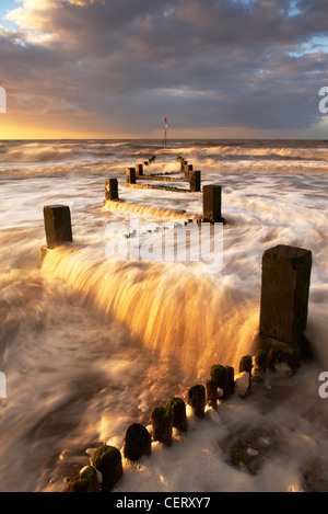 Groynes on Hunstanton beach taken at sunset. Stock Photo