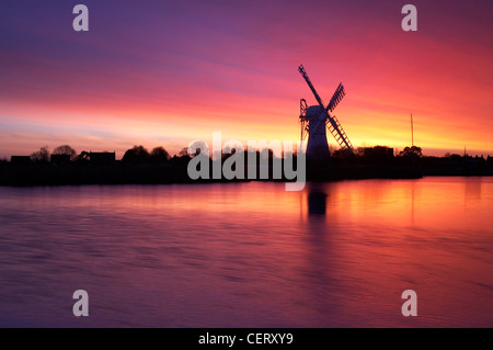 A view toward Thurne Windmill at dawn on the Norfolk Broads National Park. Stock Photo