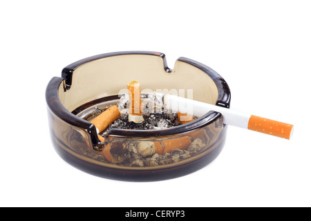 A flithy glass ash-tray photo on the white background Stock Photo