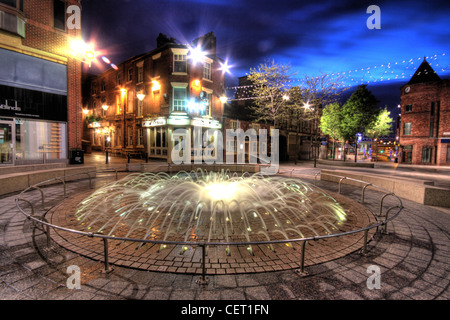 Bridge St / Hatters Row Fountain Opposite The Blue Bell Pub, Horse Market Street, Warrington at dusk, Cheshire, England WA1 1TS Stock Photo