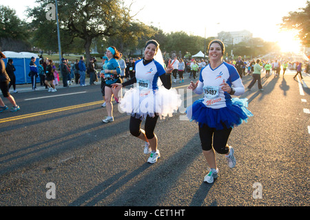 Athletes from Monterrey, Mexico run with more than 18,000 runners during the Austin marathon wearing funny ballerina tutu's Stock Photo