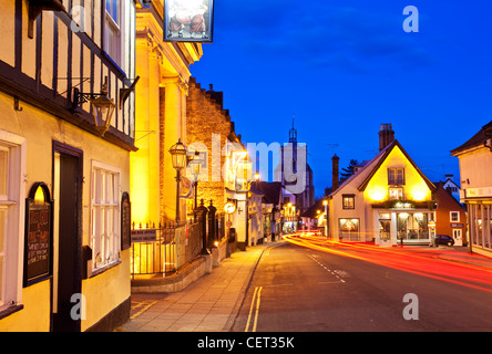 Light trails from cars in Diss town centre at dusk. Stock Photo