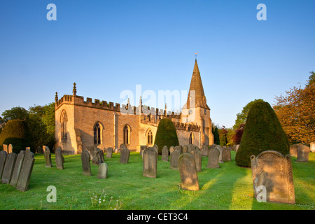 First light over the parish church of St Anne in Baslow. The clock face has VICTORIA 1897 in the place of numbers in commemorati Stock Photo