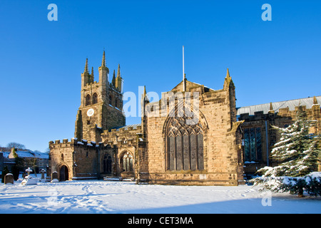 Snow covering the churchyard of Tideswell Church, known as the 'Cathedral of the Peak' in the Peak District National Park. Stock Photo