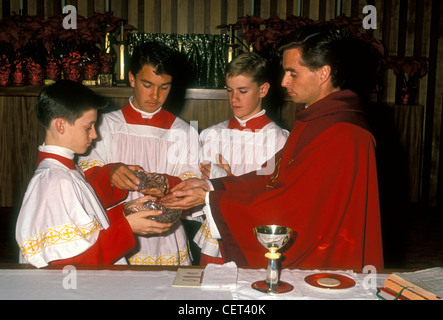 Roman Catholic priest, altar boys, preparation of the gifts, Eucharistic Prayer, church service, mass, Novato, California Stock Photo