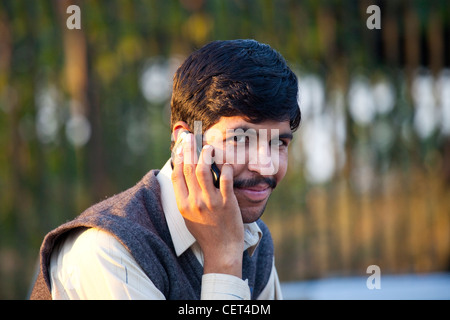 Pakistani man on a mobile phone in Islamabad, Pakistan Stock Photo