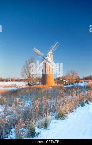 Snow on the ground around the newly restored Hardley Drainage Mill, originally built in 1874, on the Norfolk Broads. Stock Photo