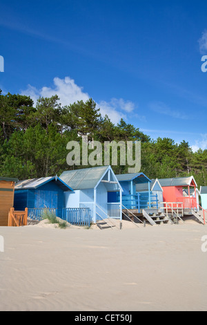 Colourful beach huts along the seafront at Wells-next-the-Sea. Stock Photo