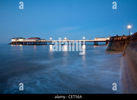 Cromer Pier, home to the Cromer Lifeboat Station and the Pavilion Theatre, on the Norfolk coast at dusk. Stock Photo