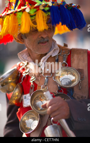 a man in traditional dress, Place Jemaa-el-Fna, Marrakech, Morocco Stock Photo