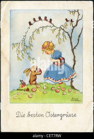 Easter postcard printed in Austria, shows a little girl with a basket, bunny and Easter decoration, circa 1941 Stock Photo